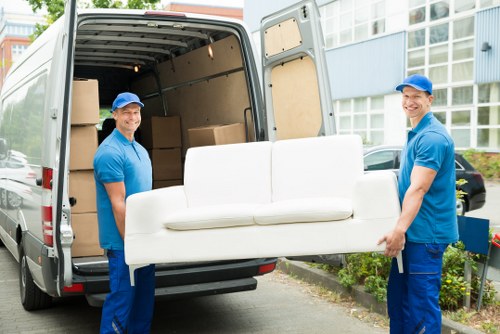 Man and van loading furniture in New Malden