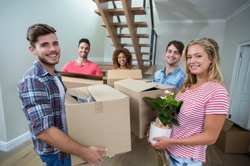 Man and van service terms document with moving vehicle and boxed belongings