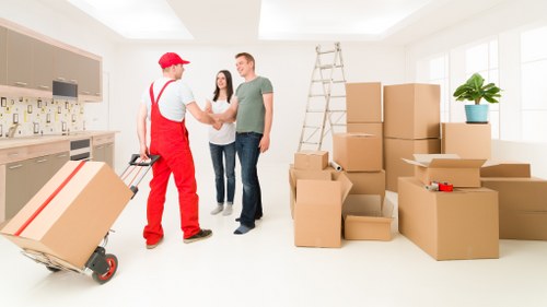 A removals team planning a move on a New Malden street