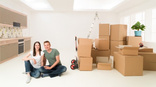 Packed boxes and furniture ready for a home move in New Malden